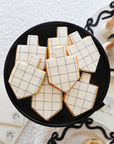 Cream & Black Bows Windowpane Dreidel Cookies
