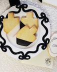 Cream & Black Bows Dreidel Shaped Dipped Sugar Cookies