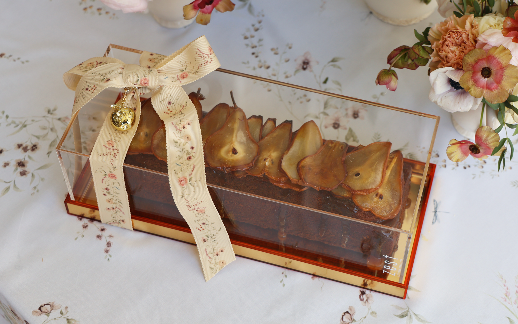Caramelized Honey Pear Log Cake in Golden Lucite Dome